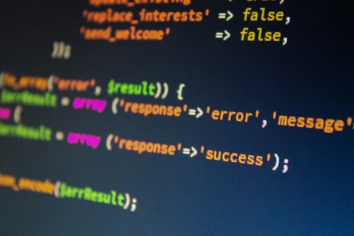 A developer desk with two monitors showing REST and GraphQL API requests
